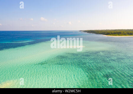 Coral reefs and atolls in the tropical sea, top view. Turquoise sea water and beautiful shallows. Philippine nature. Stock Photo