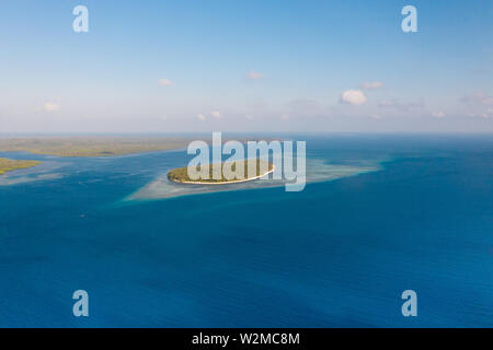 Large islands located on the atolls, a top view. Island with forest. Stock Photo