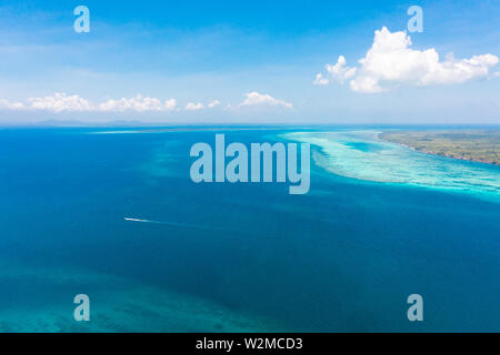 Large islands located on the atolls, a top view. Island with forest. Stock Photo