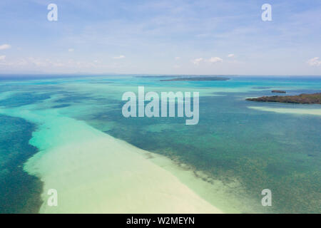 Coral reefs and atolls in the tropical sea, top view. Turquoise sea water and beautiful shallows. Philippine nature. Stock Photo