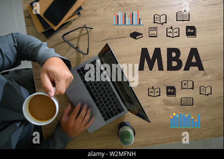 MBA man hands on modern laptop Master of Business Administration Stock Photo
