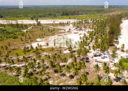 Helipad on a tropical island. Balabac, Palawan, Philippines. Helipad among the palm trees on a tropical island, top view. Stock Photo