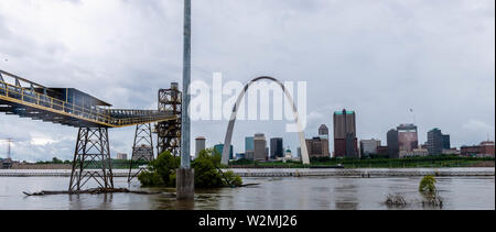 Illinois National Guard Soldiers of the 933rd and 233rd Military Police Companies patrol the levee directly across from downtown St. Louis, Missouri. Heavily industrialized the east shoreline of the Mississippi River experienced significant impact by near record floodwaters. Stock Photo