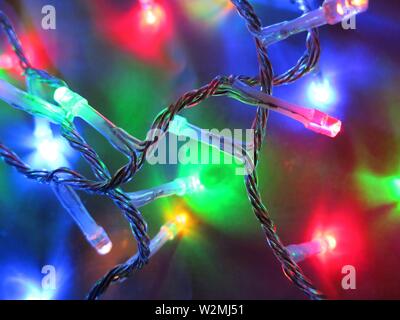 Macro photography of christmas lights decorating a tree. Concept : festive season. Stock Photo