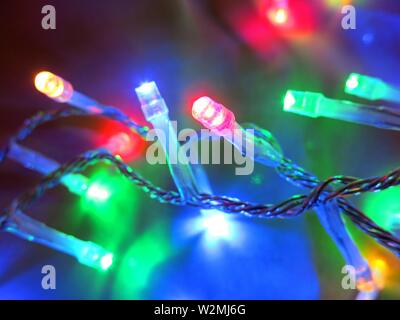 Macro photography of christmas lights decorating a tree. Concept : festive season. Stock Photo
