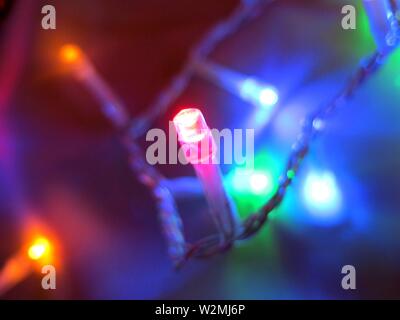 Macro photography of christmas lights decorating a tree. Concept : festive season. Stock Photo