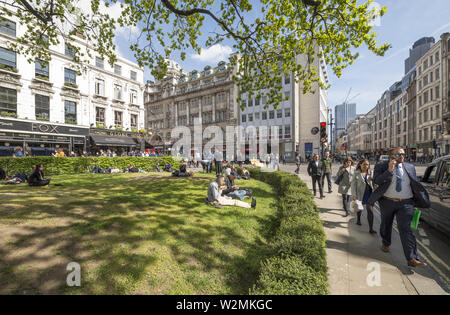 Bustling and relaxing city workers in the financial district of The City of London. Stock Photo