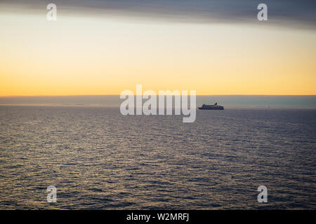 The ferry sails at dawn. Very beautiful sky Stock Photo