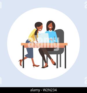 businesswomen coworkers sitting at workplace desk two african american business women using laptop working process teamwork concept flat full length Stock Vector