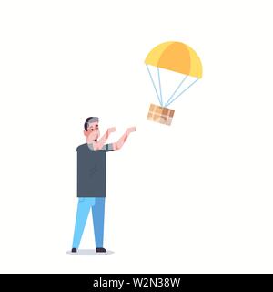 man catching parcel box falling down with parachute from sky transportation shipping package air mail express postal delivery concept full length flat Stock Vector