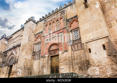 The Mosque Cathedral in Cordoba, Spain. Exterior wall with great golden door - famous landmark in Andalusia Stock Photo