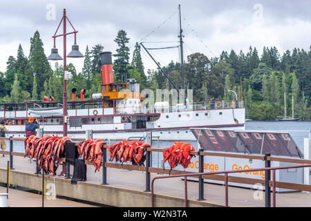 Steam ship SS Earnslaw passing Queenstown wharf on cloudy day Lake Wakatipu, Queenstown New Zealand Stock Photo