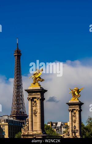 Gilded sculptures with winged horses sit at the ends of the Pont Alexandre III (bridge) across the Seine River, with the Eiffel Tower in the