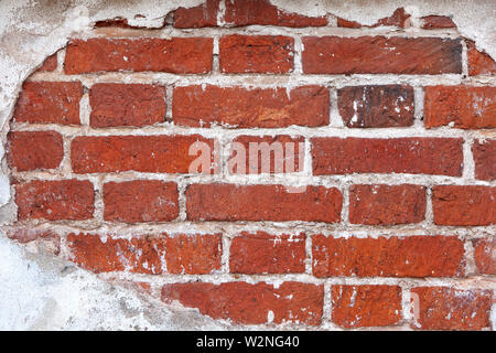 Background from old brick wall of ancient building, frame from plaster. Close-up. Copy space. Stock Photo