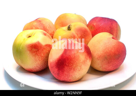 Fresh nectarines isolated on white background Stock Photo