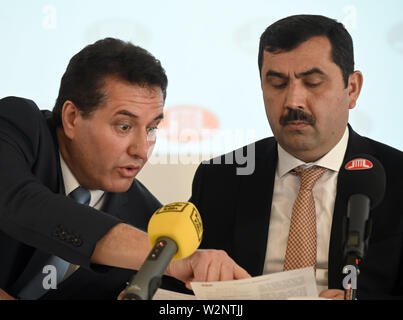 10 July 2019, North Rhine-Westphalia, Cologne: Zekeriya Altug, Head of Department for External Relations (l) and Kazim Türkmen, Chairman of the DITIB Association (r), sit on the podium at a press conference of the Islamic Association Ditib. Photo: Henning Kaiser/dpa Stock Photo