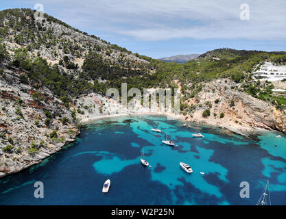 Drone point of view aerial photo moored yachts on the bright blue bay on the Cala Blanca Andratx in the Palma de Mallorca, Spain Stock Photo