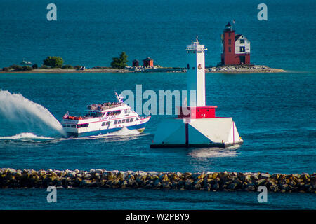 Star line ferry passing the two lighthouses on Mackinac Island Michigan Stock Photo