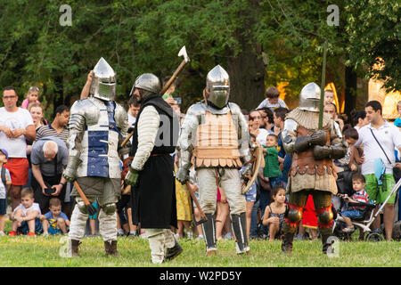 Nis, Serbia - June 15. 2019 Festival of medieval military culture. Reconstruction of knight battles. A group of knights preparing for the group fight Stock Photo