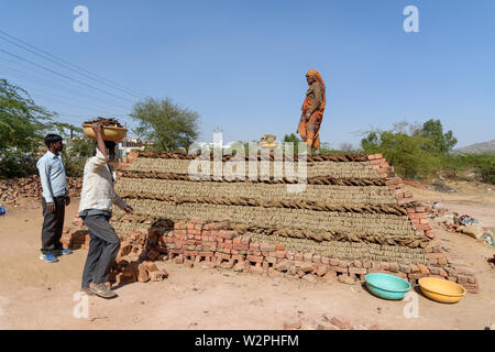 Ajmer, India - February 07, 2019: Indian people make manual clay bricks Stock Photo