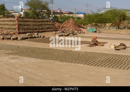 Ajmer, India - February 07, 2019: Indian people make manual clay bricks Stock Photo