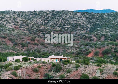 La Luz, USA - June 8, 2018: New Mexico small town city in Otero County and house during sunset on mountain hill with adobe architecture Stock Photo
