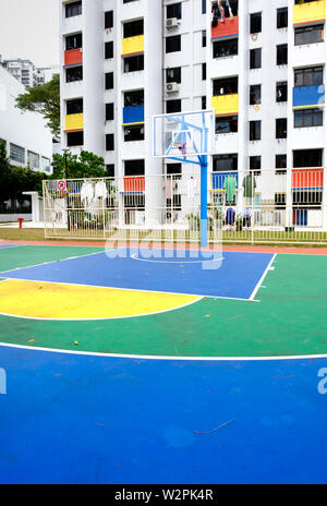 Singapore-02 MAR 2019: Sinapore colorful hdb facade and the outdoor basketball playground Stock Photo