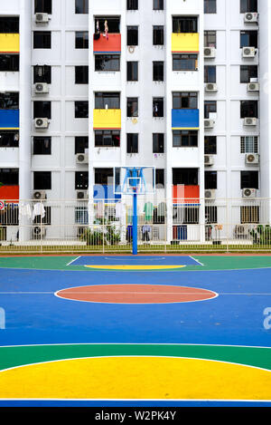 Singapore-02 MAR 2019: Sinapore colorful hdb facade and the outdoor basketball playground Stock Photo