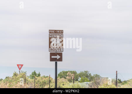 Santa Fe, USA Historic highway route 66 sign near city with pre 1937 text and arrow direction to town Stock Photo
