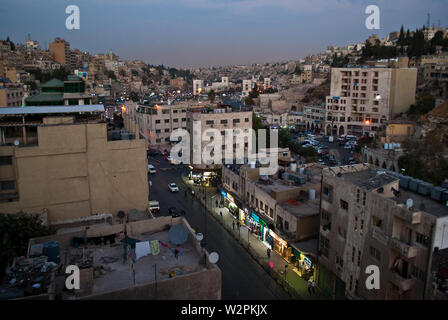Close-up view of some residential buildings seen from the top in Jordan. Plenty of houses and cars in narrow streets.