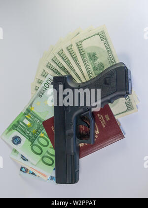 dollars and euro and passport - gangster terrorism Stock Photo