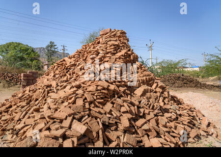 Indian people make manual clay bricks in Ajmer. Rajasthan. India Stock Photo