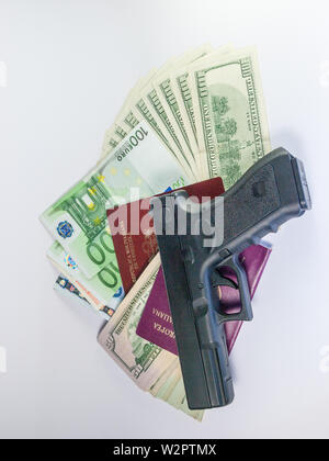 dollars and euro and passport - gangster terrorism Stock Photo