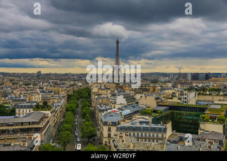 Panoramic aerial view of Paris with the famous and iconic Eiffel Tower in the centre and the Avenue d'Iéna leading to the Trocadéro on a cloudy day. Stock Photo