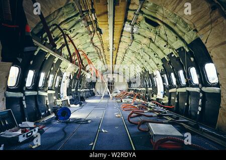Interior of commercial airplane under heavy maintenance. Themes safety, control and aerospace industry. Stock Photo