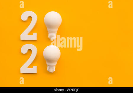 2020 creativity inspiration concepts with text nuber and lightbulb on color background.Business resolution,action plan ideas.glowing contents Stock Photo