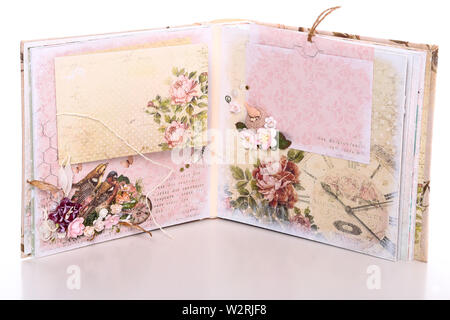 Handmade scrapbooking boxes and books items on white background Stock Photo