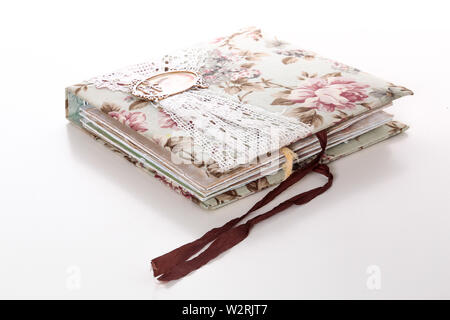 Handmade scrapbooking boxes and books items on white background Stock Photo