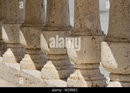 closeup of ancient stone columns under the sunlight Stock Photo