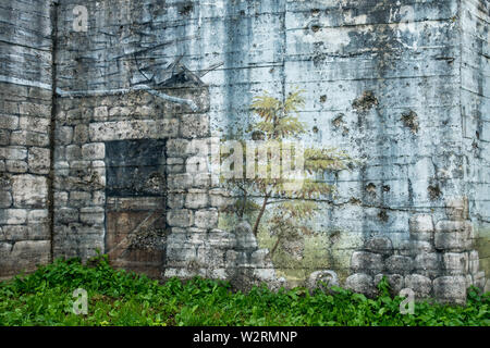 Camouflage painting on rear of gun casemate / artillery bunker of WWII Batterie d'Azeville Battery, part of German Atlantic Wall, Normandy, France Stock Photo