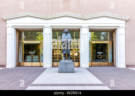 Santa Fe, USA - June 14, 2019: Capitol building in downtown center of city with statue by entrance Stock Photo