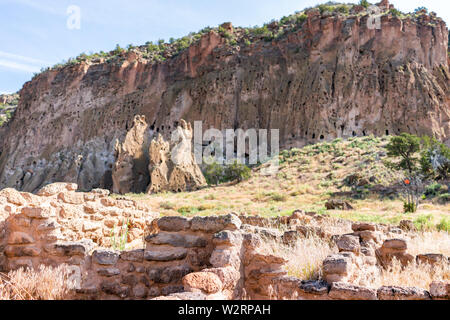 Canyon and old pueblo stone ruins at Main Loop trail in Bandelier National Monument in New Mexico during summer in Los Alamos Stock Photo