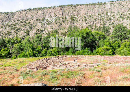 Canyon and old stone ruins at Main Loop trail in Bandelier National Monument in New Mexico during summer in Los Alamos Stock Photo