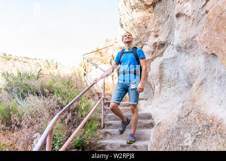 Los Alamos park with man hiking walking on steps of Main Loop trail path in Bandelier National Monument in New Mexico Stock Photo
