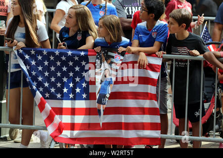 New York City, New York, USA. 10th July, 2019. Thousands of New Yorkers turned out for a massive celebration of the U.S.Women's National soccer team's fourth World Cup victory. Confetti rained down from buildings along the Canyon of Heroes in lower Manhattan on 10 July 2019. Among the most passionate celebrants were young soccer players. Credit: G. Ronald Lopez/ZUMA Wire/Alamy Live News Stock Photo