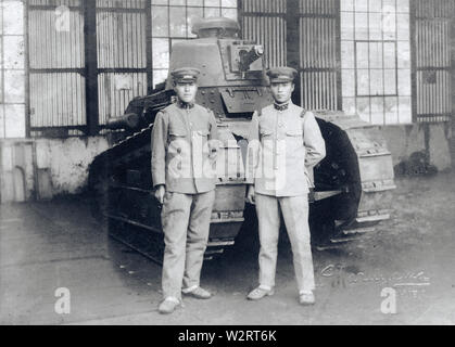 [ 1930s Japan - Japanese Soldiers and French Tank ] —   Two Japanese soldiers stand in front of a French Renault FT-17 light infantry tank, one the most revolutionary tank designs in history.   Japan imported 13 FT-17's in 1919 (Taisho 8), which were used in the Manchurian Incident (1931-1932) and for training. The French guns were replaced with Japanese armament.  20th century vintage gelatin silver print.