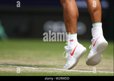 Wimbledon, London, UK. 10th July 2019. Wimbledon, UK. 10th July 2019. 10th July 2019, The All England Lawn Tennis and Croquet Club, Wimbledon, England, Wimbledon Tennis Tournament, Day 9; Shoe detail of Kei Nishikori during his match versus Roger Federer Credit: Action Plus Sports Images/Alamy Live News Credit: Action Plus Sports Images/Alamy Live News Stock Photo