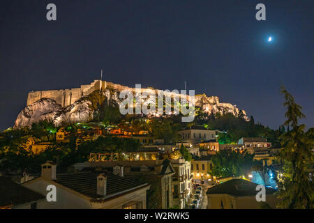 Athens, Greece, 9 July 2019 - The historic Acropolis is lit up atop a hill as seen from Athens's Placa neighborhood.  Photo by Enrique Shore/Alamy Sto