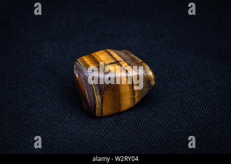 Tiger eye gemstone beautiful gemstone shining in yellow and brown Stock Photo