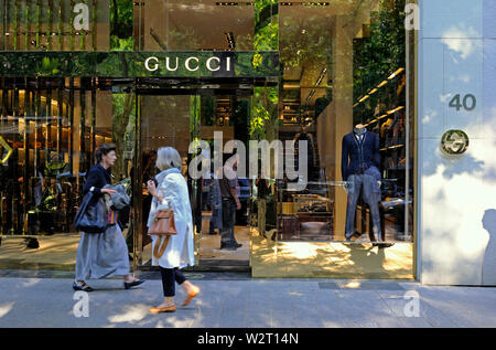 dusseldorf, germany - april 30, 2011: women passing by a gucci boutique on konigsalle in dusseldorf    d110038 (5227) - dusseldorf - 2011-04-30 sa --- Stock Photo